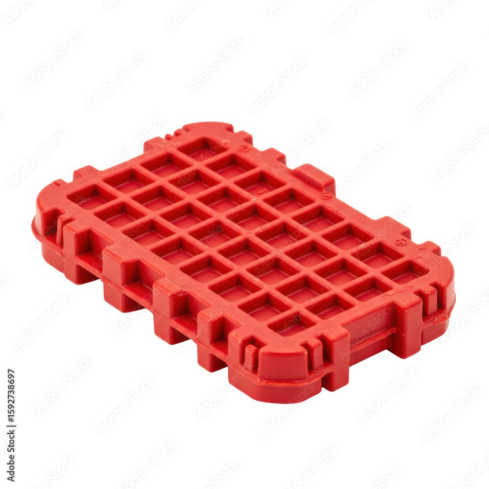 Poster bright red, smooth plastic waffle-shaped object with interlocking mechanisms, perfectly centered on 