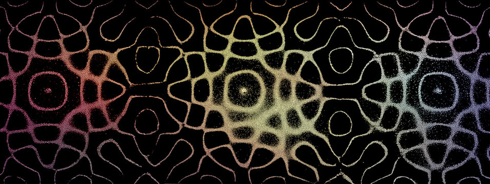 Rainbow harmonic cymatic sand pattern on dark background
