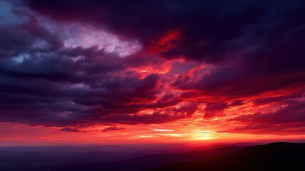 Fototapeta premium Dramatic Sunset Sky with Fiery Red and Purple Clouds Illuminating Twilight Horizon in Landscape View