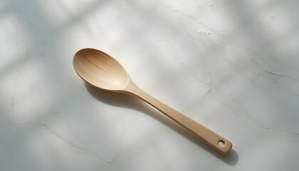 Wooden spoon placed on clean white table
