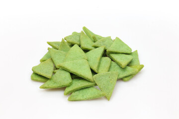 Fototapeta premium Pile of green triangle shaped protein snack isolated on white background