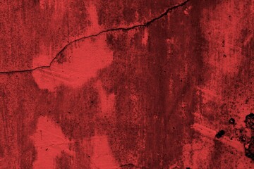 Red background, Rough textured red wall with visible cracks and dark abstract patterns, ideal for...