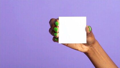 Hand holding blank white note