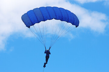 Skydiver in a blue sky	