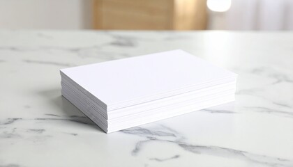 Stack of blank white papers on marble table
