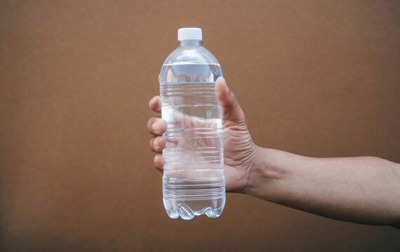 hand holding bottle of water