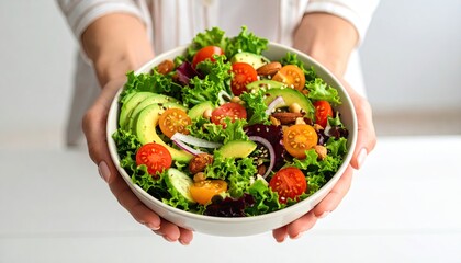 Woman holding a healthy salad bowl