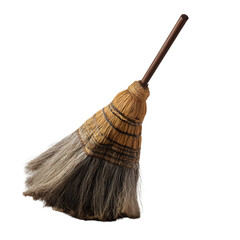 A worn broom with a wooden handle and straw bristles against a black background studio shot