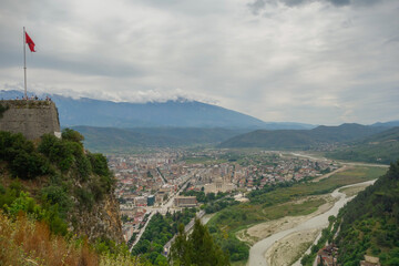 tourists on observation deck of Berat Castle look out over city below. Berat, Albania, Unesco World Heritage Site