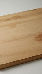Fototapeta premium Rectangular wooden cutting board with natural grain on neutral background