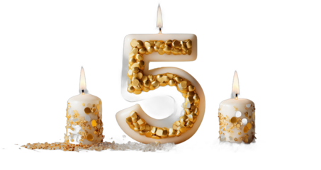 Celebration with a five-shaped candle decorated with gold accents and two additional candles glowing beside it