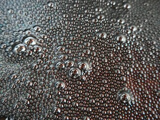 Black sludge hot car oil. hot used car oil. Rainbow droplets. Abstraction