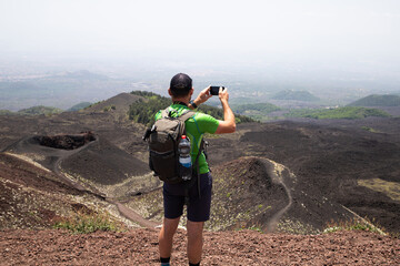 hiker trekking on mount Etna