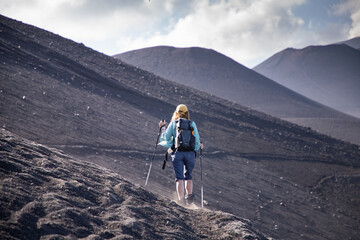 hiker trekking on mount Etna
