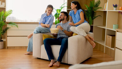 Enjoying quality time together with snacks in a cozy living room atmosphere