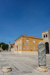 Naklejka premium Zadar, Croatia - 04.22.2025: ruins of ancient Roman forum in city old town