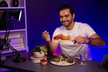 Healthy influencer in host channel presenting croissant with ingredient health powder on diet life...