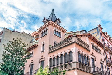 Historic Xalet Juando building in Girona, Spain, designed by Isidre Bosch Bataller. Neo-Gothic pink...