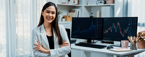 Profile of young Asian businesswoman smiling on happy face with white suit sitting chair against...