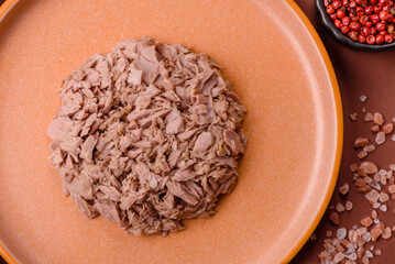 Tuna, canned fish in a can and on a plate for making sandwiches and other food. Canned tuna