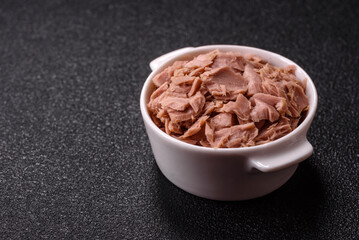 Tuna, canned fish in a can and on a plate for making sandwiches and other food. Canned tuna