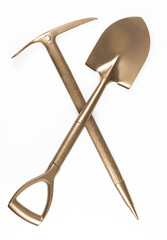 golden shovel and golden pickaxe isolated on white background © serikbaib