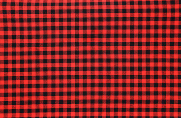 texture of red black checkered fabric pattern background. traditional tablecloth in red and...