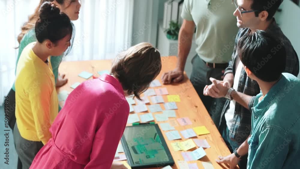 Poster aerial view of developer team discussing and showing digital program and writing by using ux ui desi