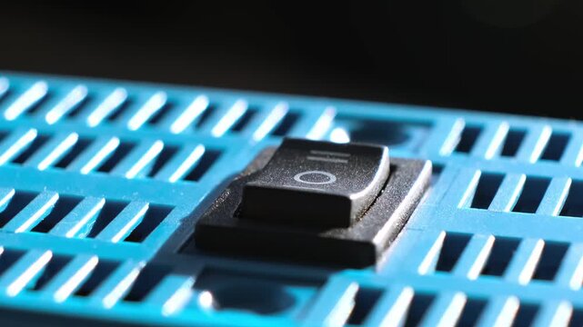 A swither button close-up. KCD1-101 6c Rocker Switch electrical component rocker-style actuator for on off on control. Simple durable reliable switching mechanism. Key in middle position. 4k footage.