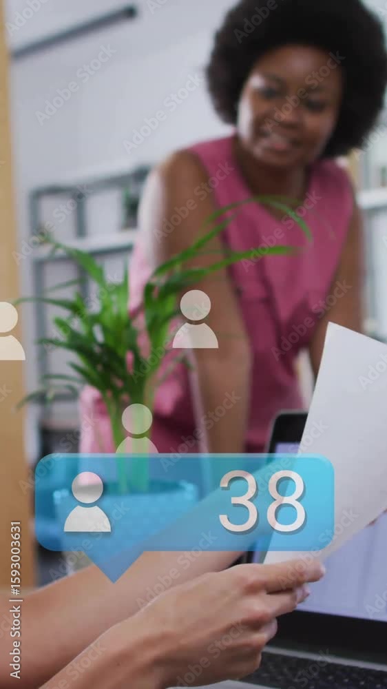 Aufkleber discussing data with digital animation overlay, business team in office setting