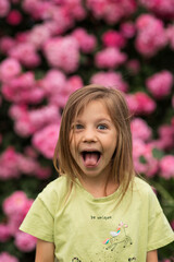 the emotions of a girl who sticks out her tongue. Close-up portrait