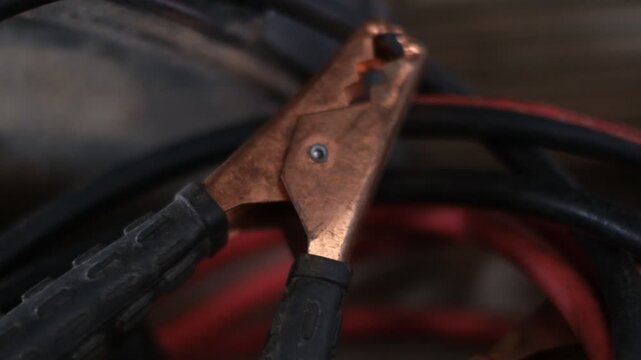 A black and red tool with a silver handle. The tool is used to connect electrical wires. Concept of technicality and precision