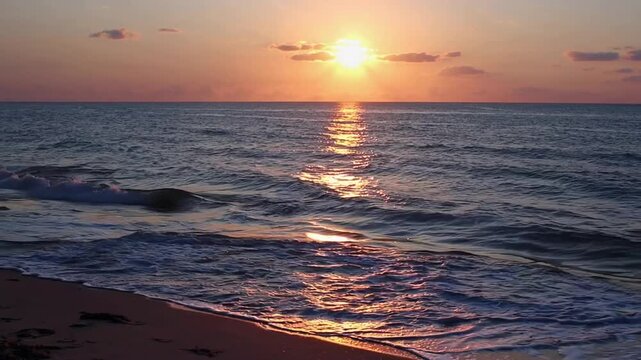 Sunrise Illuminating the Rolling Waves Along the Shoreline of Fenwick Island's Beach