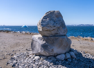 Steel needle inserted into granite rock on shore by the museum in Colonial Harbour in Nuuk in...