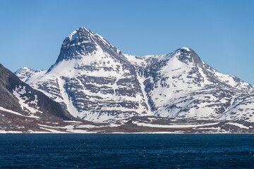 Ukkusissat mountain is a dominant peak around Nuuk seen in early morning during cruise ship arrival in port © steheap