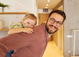 Portrait of father and daughter having fun at home, family life, parenting, love and bonding...