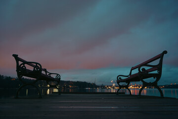 Benches on a pier during the night
