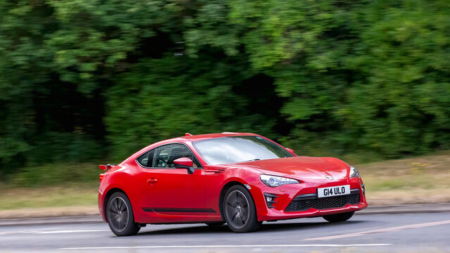 Milton Keynes,Bucks,UK - July 17th 2025: 2020 red Toyota gt86 car driving on a British road