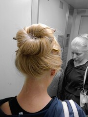 
Blonde with a bun in an elevator