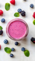 Delicious berry smoothie recipe: healthy breakfast drink with fresh fruits and mint leaves