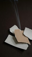 Burning paper scraps and smoke stock photo for fire safety and destruction concept