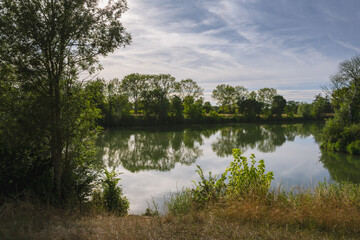 Walking along the river Saône in Seurre, Côte-d'Or, France in summer