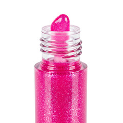A vibrant pink glitter lip gloss with applicator showcases cosmetic beauty and sparkling makeup trends.