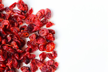 Dried cranberries piled on a white background