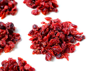 Dried cranberries piled on a white background
