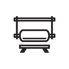 Minimalist cylindrical object hangs above sturdy trestle against white backdrop