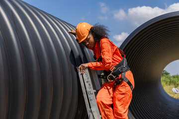 Industry Engineers Walking Inside Circular water Pipe. Engineering or Worker inspection pipe...