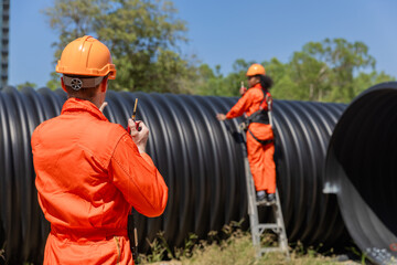 Industry Engineers Walking Inside Circular water Pipe. Engineering or Worker inspection pipe...