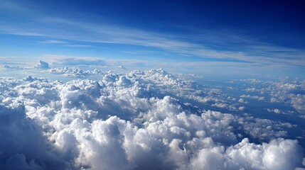 Naklejka premium Aerial blue sky vista above fluffy white cloudscape offering beautiful breathtaking natural heavenly scenery