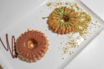 Yummy sweets made of cream cakes with a variety of flavors - Chocolate cream and nut round dessert...